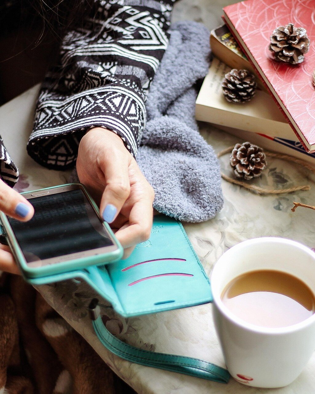 Phone, coffee and a cosy lived-in morning setup