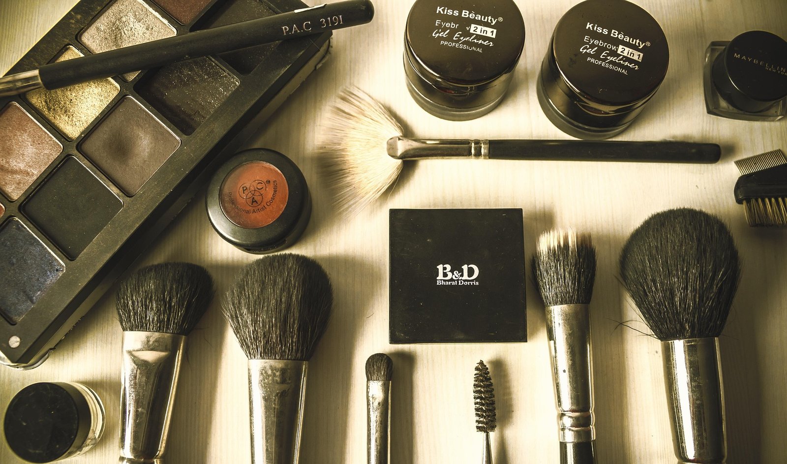 Makeup brushes and beauty products laid out as part of a morning routine
